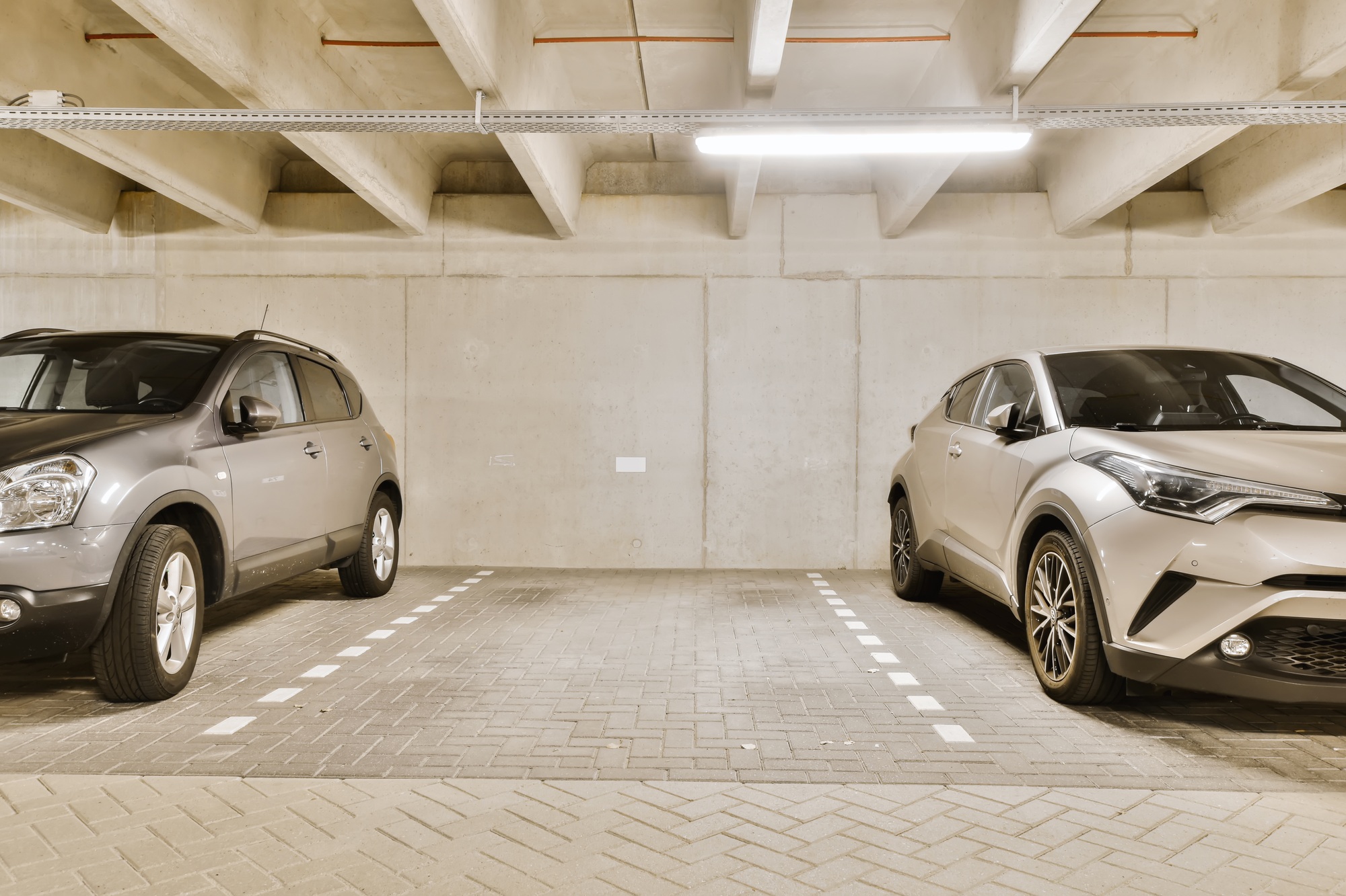 two cars parked in a parking garage